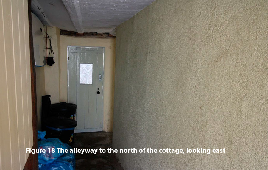 Figure 18 The alleyway to the north of the cottage, looking east